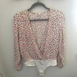 Floral long sleeved body suit, size Small